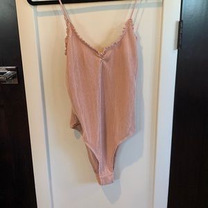 Blush body suit. Slightly worn. Urban outfitters. Size M